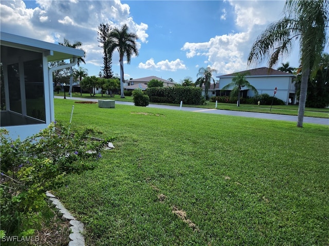 view of yard featuring a sunroom