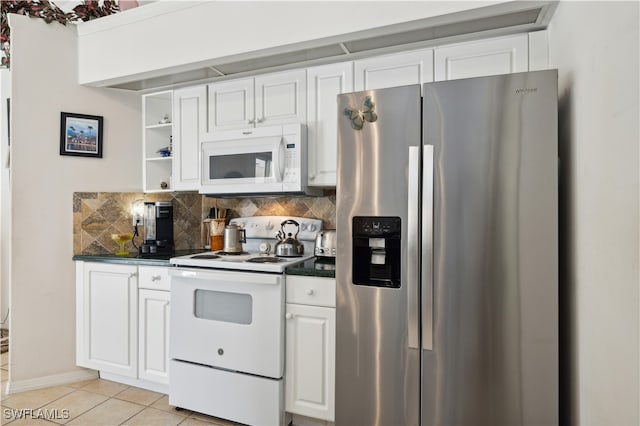 kitchen featuring light tile patterned flooring, white appliances, tasteful backsplash, and white cabinets