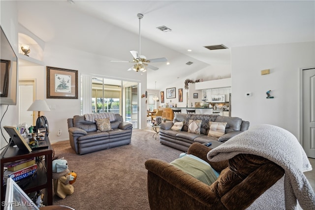 living room with ceiling fan, carpet, and vaulted ceiling