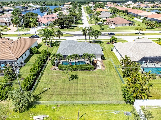 birds eye view of property with a water view