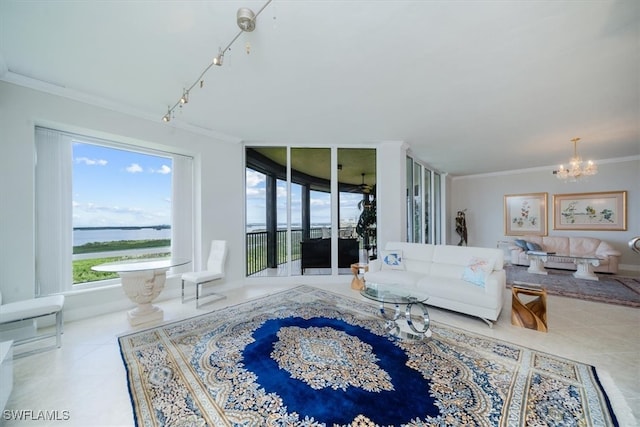 living room with a notable chandelier, a water view, light tile patterned floors, and crown molding