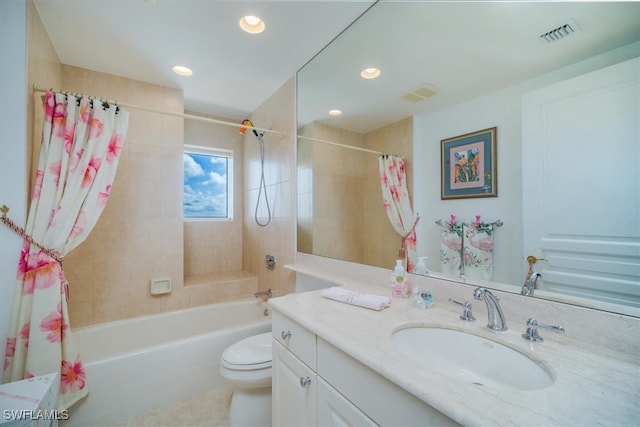 full bathroom with shower / tub combo with curtain, vanity, and toilet