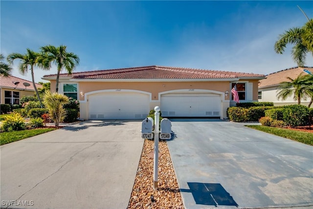 mediterranean / spanish home featuring a garage