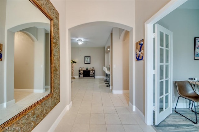 hallway with light tile patterned flooring