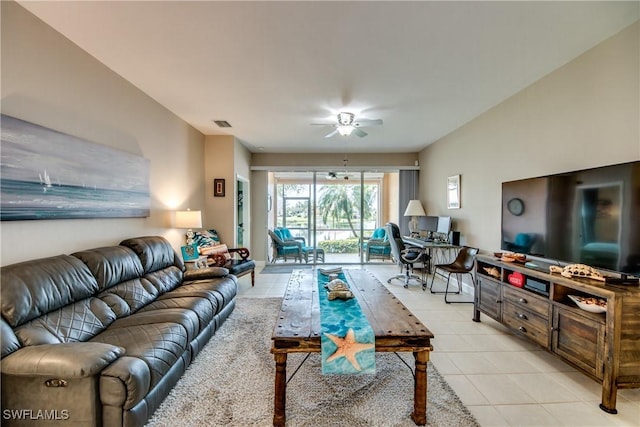 tiled living room featuring ceiling fan