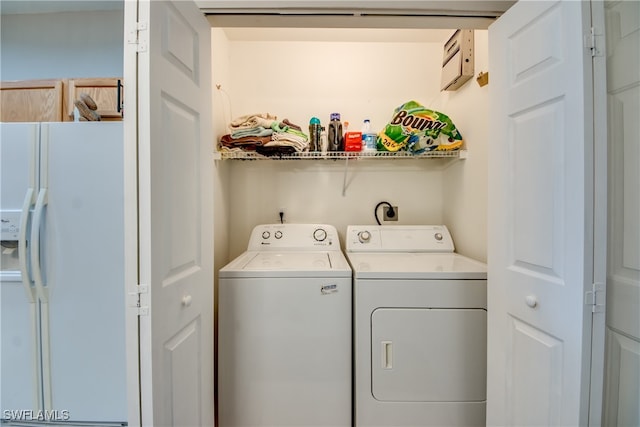 washroom with separate washer and dryer