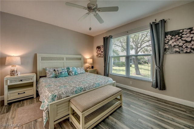 bedroom with hardwood / wood-style floors and ceiling fan