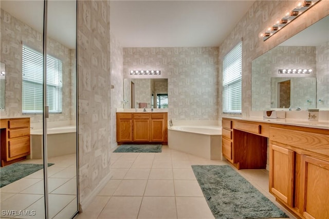 bathroom with independent shower and bath, vanity, and tile patterned floors