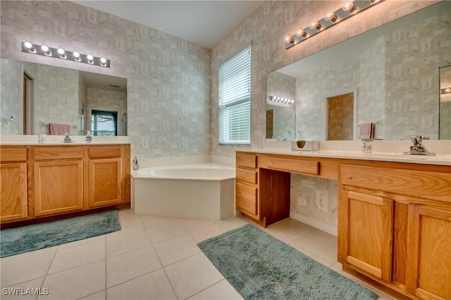 bathroom with a bathing tub, tile patterned floors, and vanity