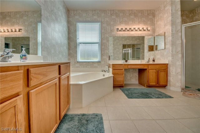 bathroom with vanity, tile patterned floors, tile walls, and separate shower and tub