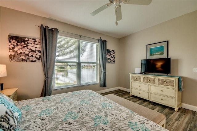 bedroom featuring ceiling fan and dark hardwood / wood-style flooring