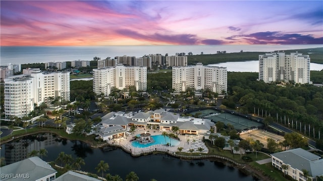 aerial view at dusk with a water view