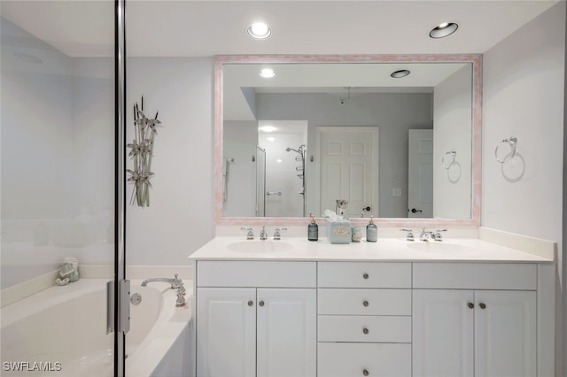 bathroom with independent shower and bath and vanity