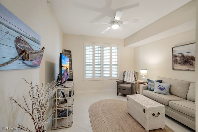 tiled living room featuring ceiling fan