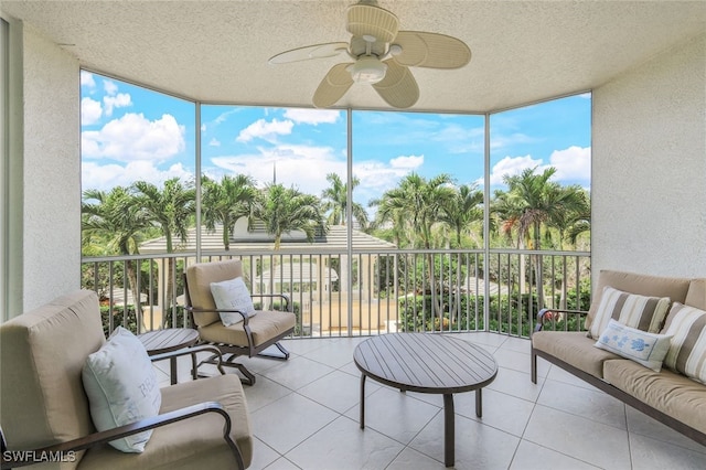 sunroom / solarium featuring ceiling fan and plenty of natural light