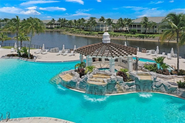 view of pool featuring a water view and pool water feature