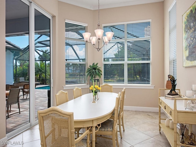 tiled dining room with an inviting chandelier and crown molding