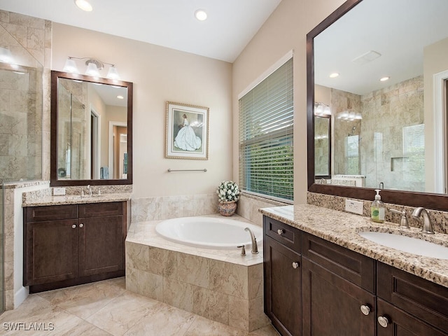 bathroom with plus walk in shower and vanity