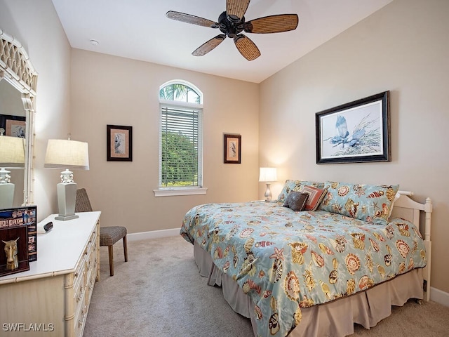 bedroom with ceiling fan and light carpet