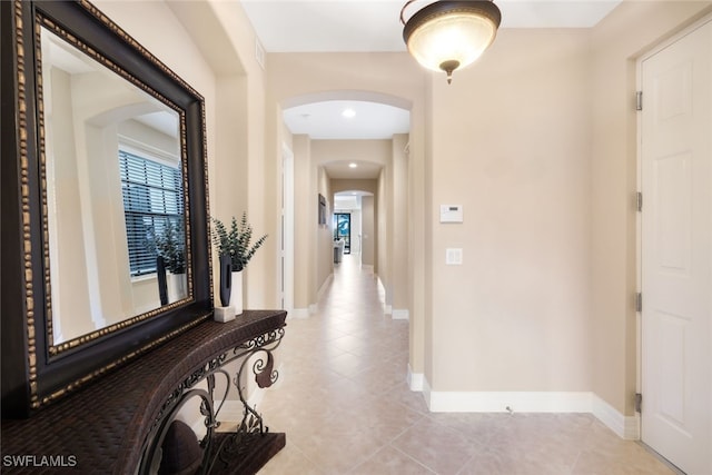 hallway with light tile patterned floors