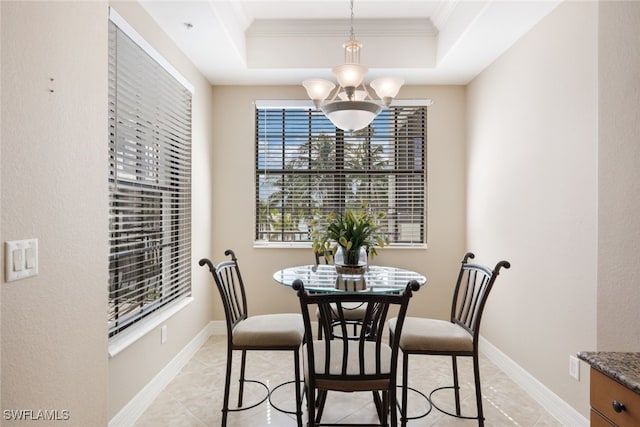 dining area featuring a raised ceiling, crown molding, light tile patterned flooring, and an inviting chandelier