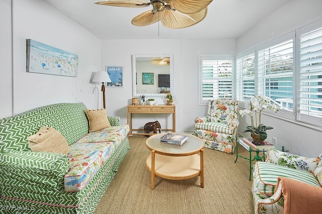 living area with a ceiling fan