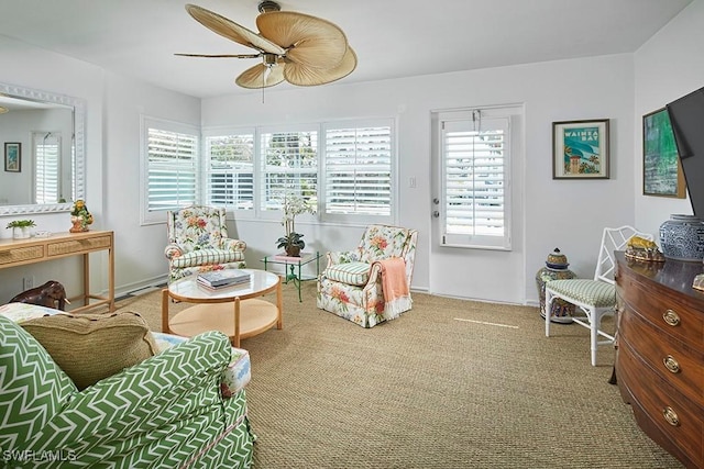 sitting room with carpet flooring and a ceiling fan