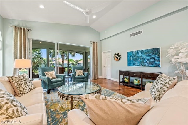 living area with visible vents, recessed lighting, lofted ceiling, and wood finished floors