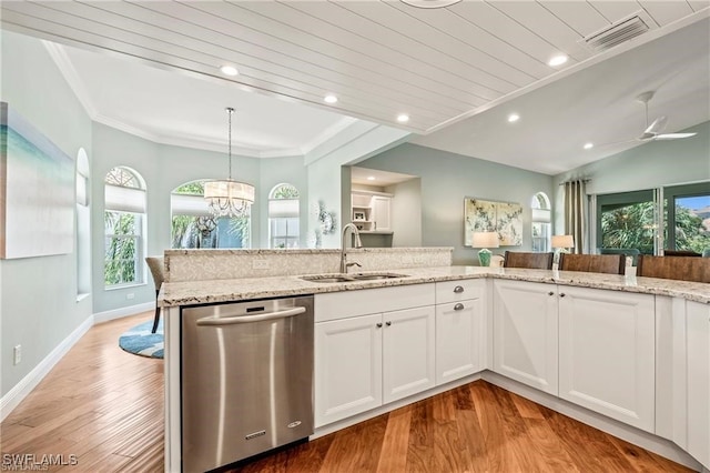 kitchen featuring visible vents, ornamental molding, a sink, light stone countertops, and dishwasher