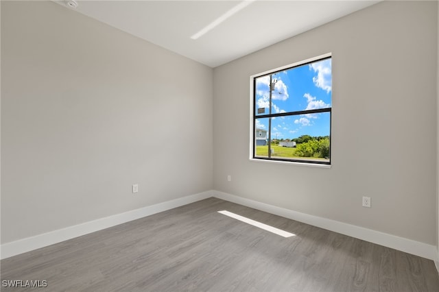 spare room with light hardwood / wood-style floors