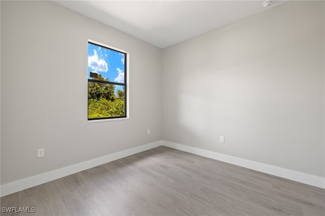 spare room with light wood-type flooring