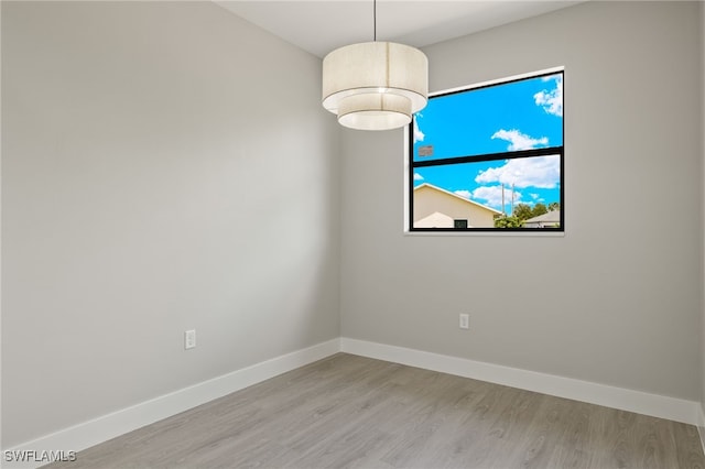 spare room featuring light wood-type flooring