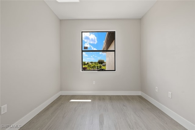 spare room with light hardwood / wood-style floors