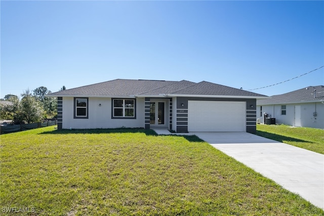 ranch-style house with a garage and a front lawn