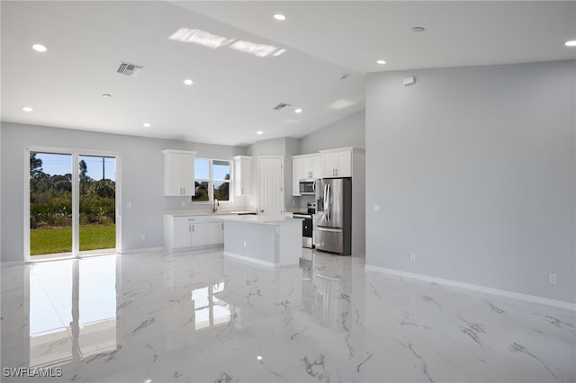 unfurnished living room with lofted ceiling and sink