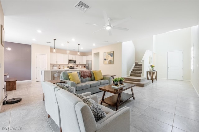 living room with visible vents, baseboards, stairway, recessed lighting, and a ceiling fan