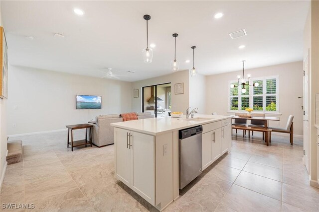 kitchen featuring a center island with sink, recessed lighting, stainless steel dishwasher, hanging light fixtures, and a sink