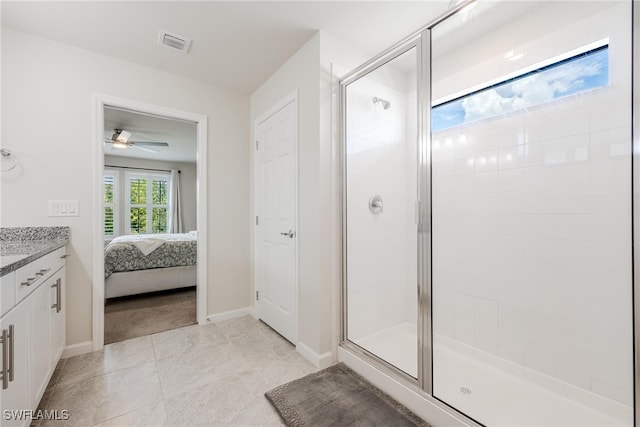 bathroom featuring vanity, tile patterned floors, ceiling fan, and an enclosed shower