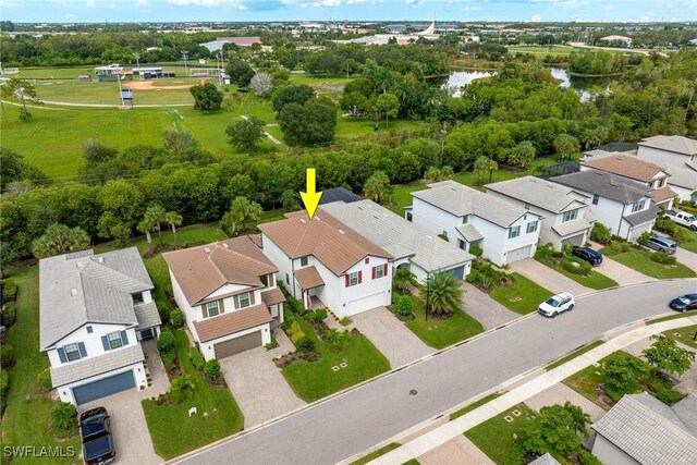 aerial view featuring a residential view and a water view