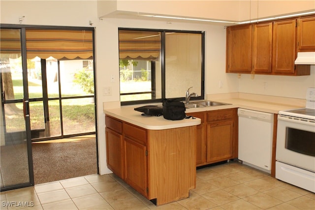 kitchen featuring white appliances, sink, light tile patterned flooring, and ventilation hood