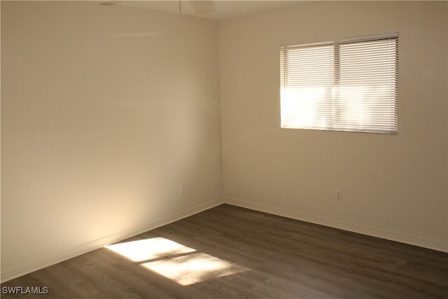 spare room featuring dark hardwood / wood-style floors