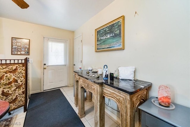 entryway with ceiling fan and light tile patterned floors