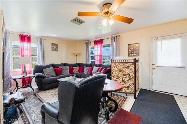 living room featuring ceiling fan and light tile patterned flooring