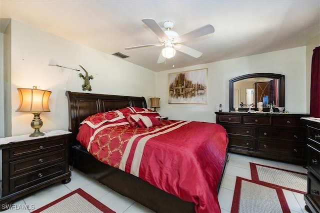 bedroom with light tile patterned flooring and ceiling fan