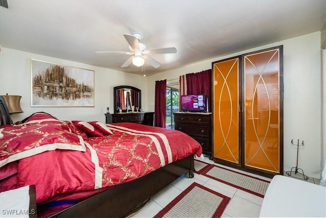 bedroom with light tile patterned flooring and ceiling fan