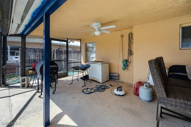 view of patio featuring ceiling fan