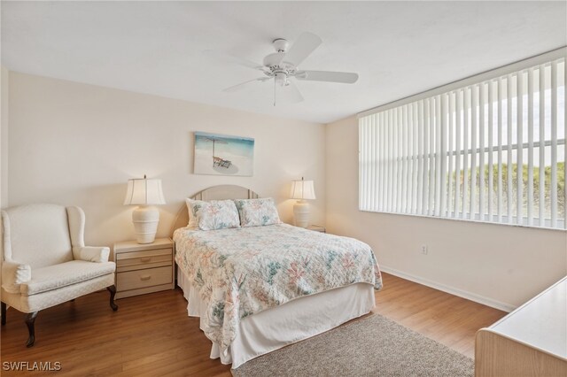 bedroom with ceiling fan and hardwood / wood-style floors