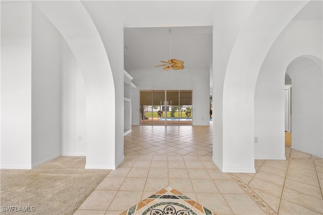 tiled foyer entrance with ceiling fan