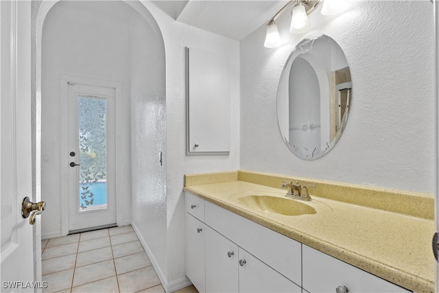 bathroom with tile patterned floors and vanity