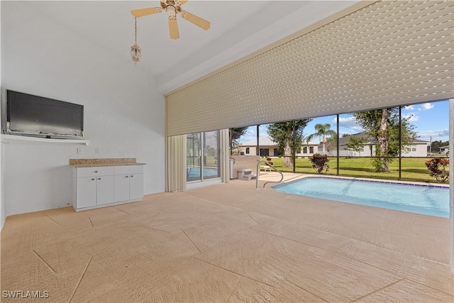 view of pool featuring ceiling fan